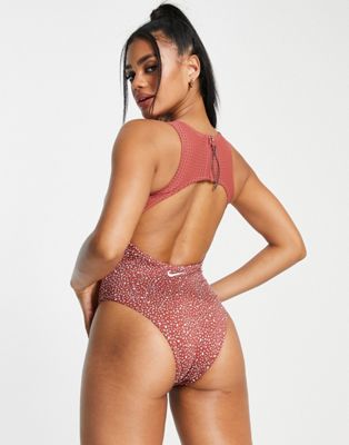 Nike keyhole back cut out one piece swimsuit in pink | ASOS