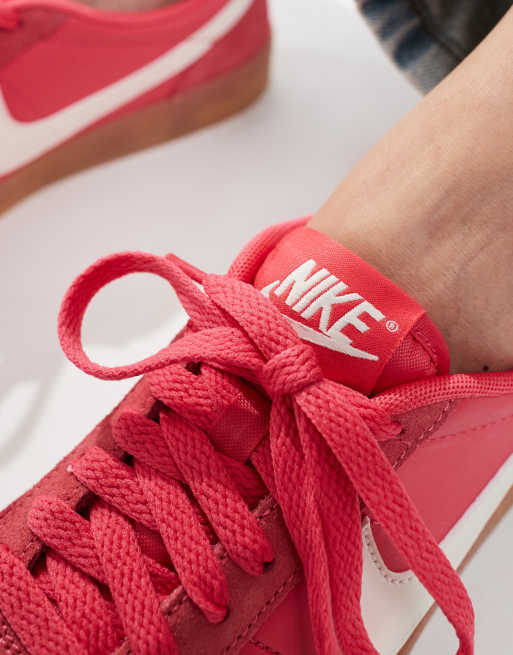 Pink suede nike trainers best sale