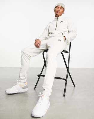 Nike knit 1/4 zip tracksuit set in off white