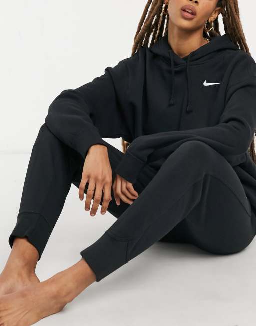 Nike left chest mini swoosh oversized hoodie in black