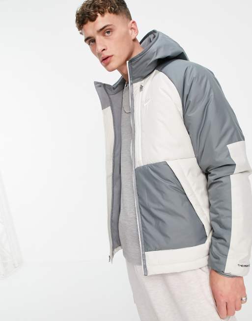 Nike Legacy Therma FIT padded hooded jacket in stone and grey ASOS