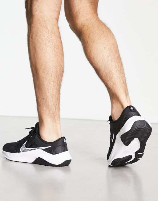 Nike Legend Essential 3 sneakers in black and white