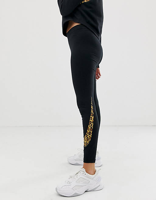 Nike - Leggings oversize neri con logo leopardato