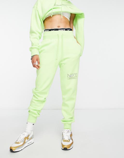 Nike - Limegrønne joggingbukser med Swoosh-grafik