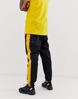 black and yellow nike sweatpants