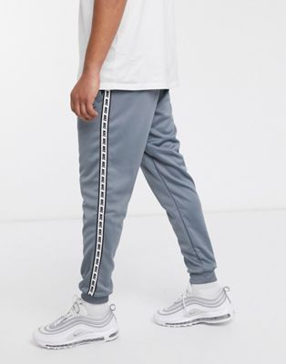 nike logo taping cuffed joggers in grey
