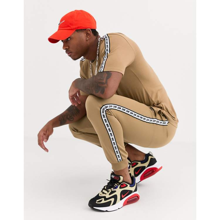 Nike logo taping cuffed joggers in sand