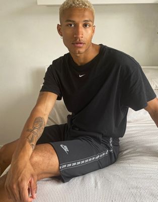 Nike logo taping polyknit shorts in 