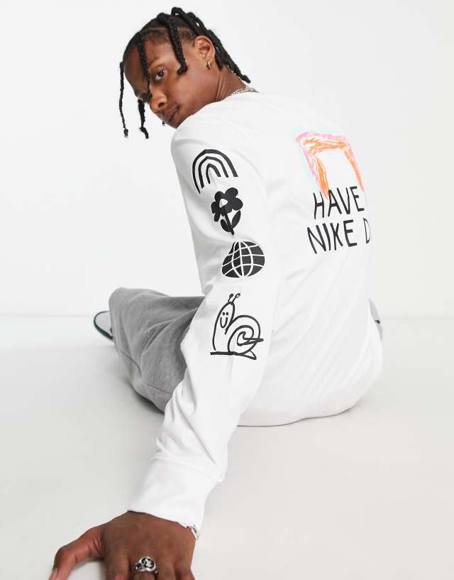 Nike long sleeve graphic t-shirt in white with arm print