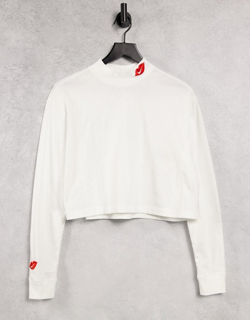 Nike long sleeve t-shirt in white with mock roll neck and swoosh kiss logo