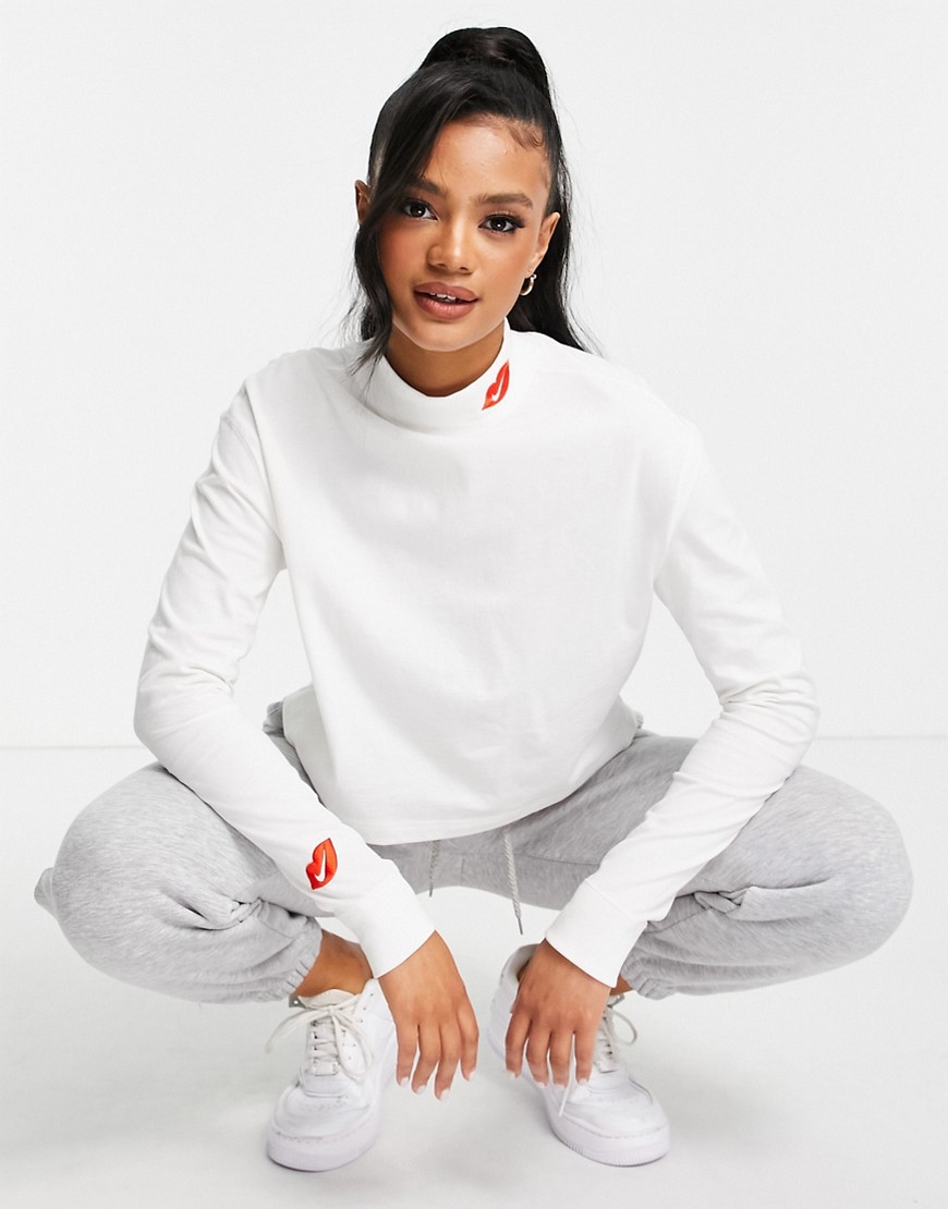 Nike long sleeve T-shirt in white with mock roll neck and swoosh kiss logo