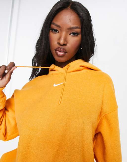 Nike Longline Kapuzenpullover in Gelb mit kleinem Swoosh Logo ASOS