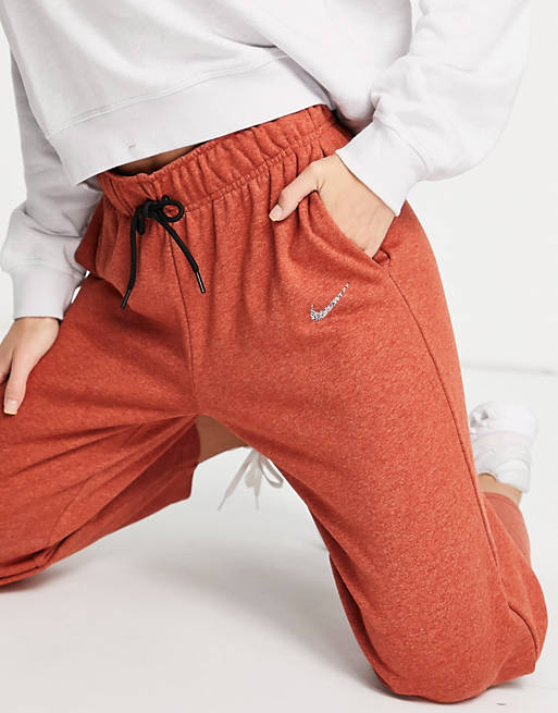 Women Nike Lounge essential fleece pants in brown marl 