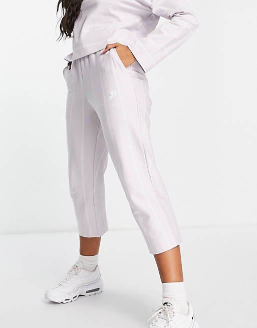 Nike Lounge tapered leg pants in lilac and white stripe