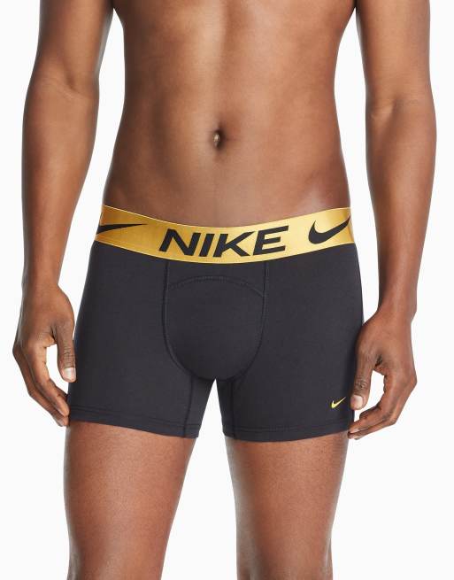 Nike Luxe cotton modal trunks in black with gold waistband | ASOS