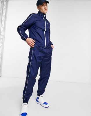 Nike – Marineblauer Trainingsanzug aus gewebtem Stoff