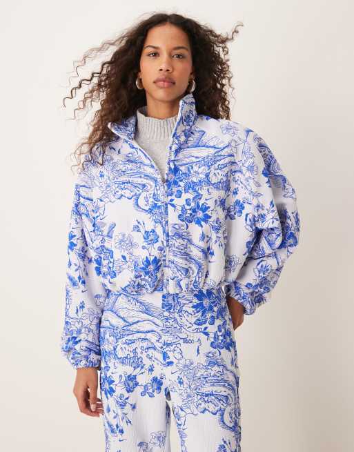 Nike MDC jaquard floral jacket in blue and white