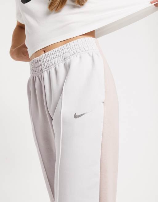 Nike Metallic Swoosh colour block joggers in neutrals