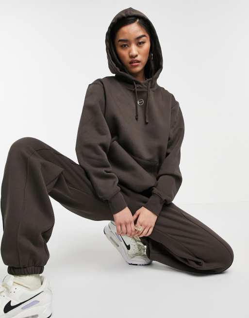 Nike metallic swoosh neutral hoodie in dark brown ASOS