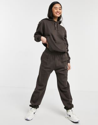 nike metallic swoosh track suit