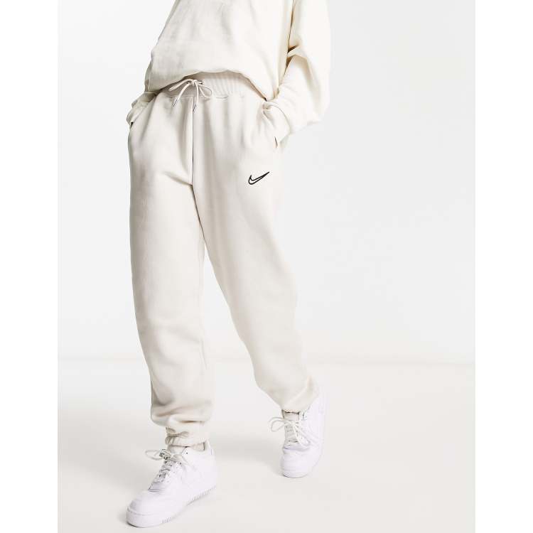 Nike Midi Swoosh phoenix fleece joggers in light orewood brown ASOS