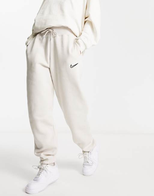 Nike Sweatpants SPORTSWEAR PHOENIX in light brown