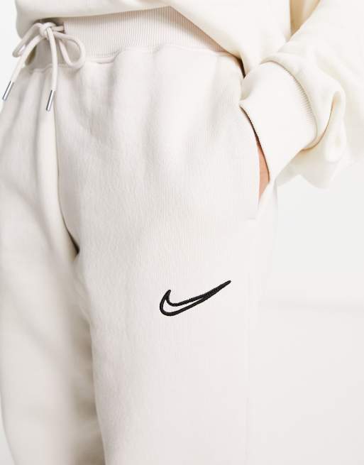 Nike Mini Swoosh wide leg joggers in taupe