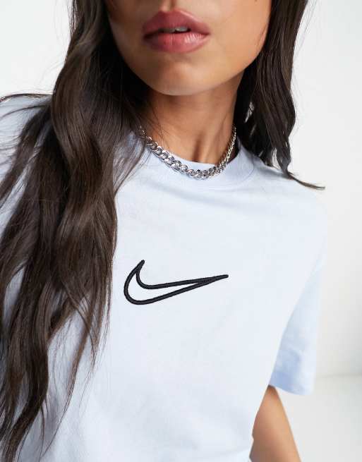 White nike shirt store with blue swoosh