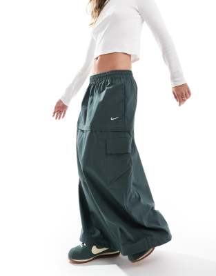 Nike - Mini-jupe/jupe longue 2-en-1 tissée avec fermeture éclair - Vert