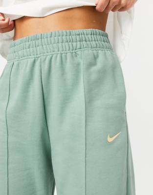 nike mini swoosh oversized green joggers