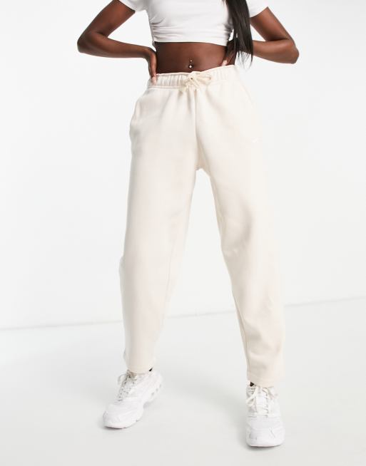 Nike mini swoosh cropped joggers in pearl white ASOS