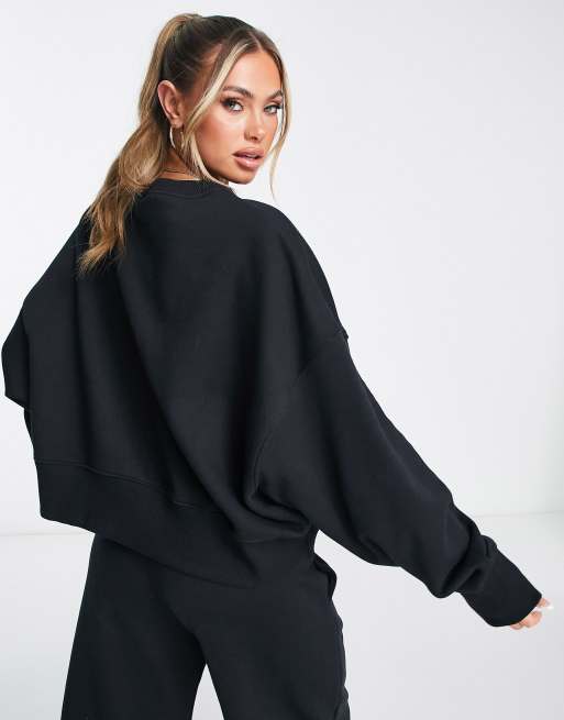 Nike mini swoosh extra oversized crop sweatshirt in black and sail ASOS