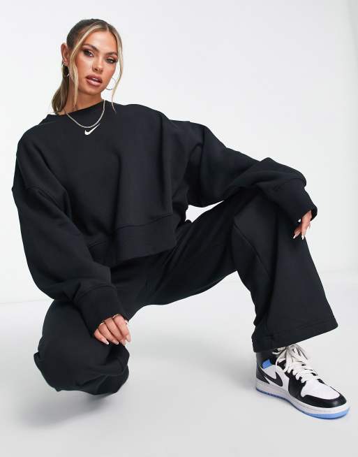 Nike mini Swoosh oversized boxy sweatshirt in black, ASOS