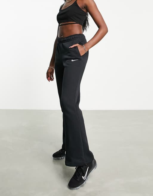 Nike mini swoosh flared joggers in black ASOS