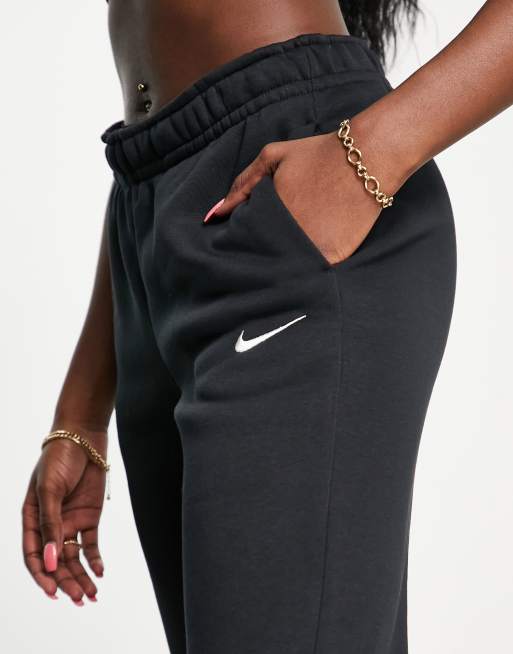 Nike mini swoosh flared joggers in black