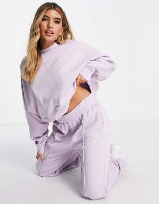 Nike mini swoosh fleece joggers in lilac ASOS