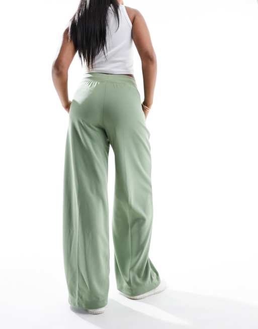 Nike mini swoosh high rise wide leg jersey trousers in oil green