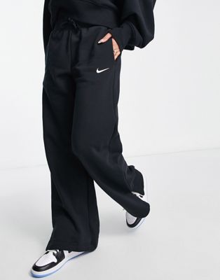 Nike mini swoosh high rise wide leg joggers in black and sail | ASOS