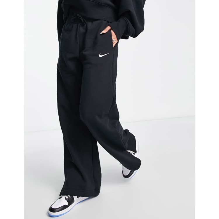 Nike slim leg swoosh black joggers hot sale