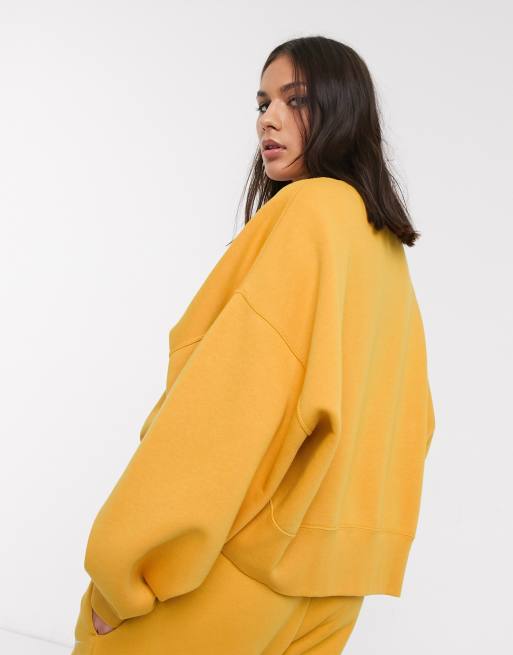 Nike mini swoosh oversized cropped yellow sweatshirt