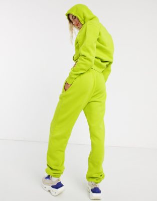 nike mini swoosh oversized yellow joggers