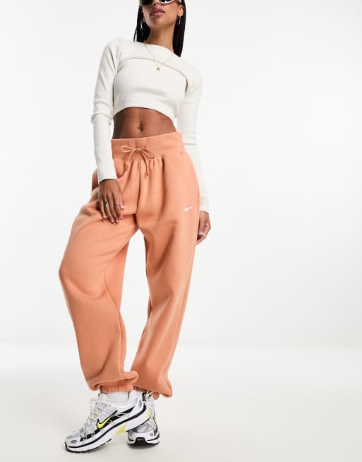 Asos nike mini swoosh joggers hotsell