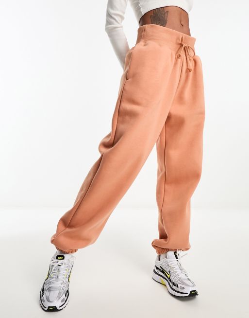 Nike mini swoosh oversized high rise joggers in amber brown