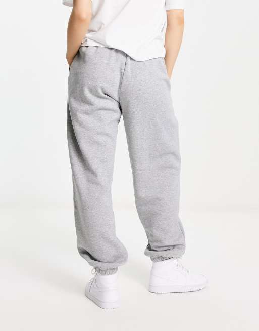 Nike mini swoosh high rise wide leg joggers in grey and sail