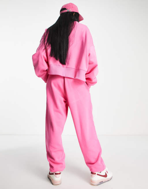 Nike mini swoosh oversized high rise joggers in pinksicle