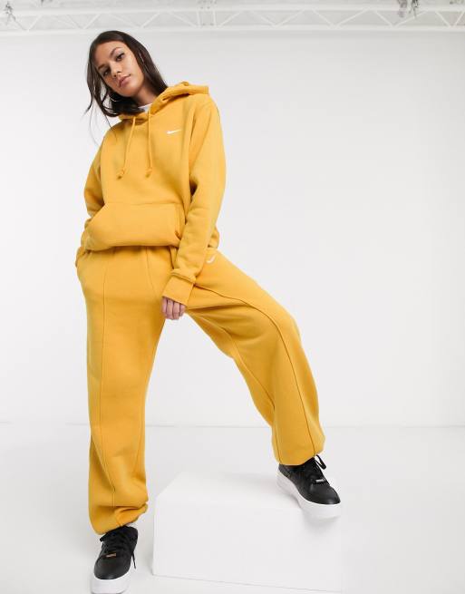 Nike mini swoosh oversized hoodie in yellow