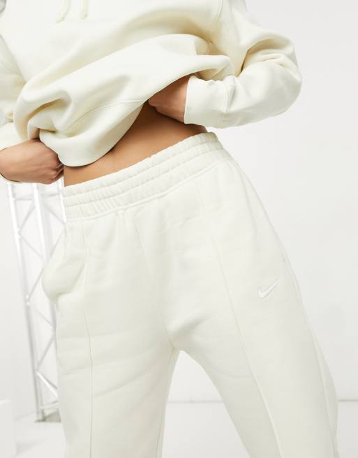 Nike Mini Metallic Swoosh Oversized Joggers In Cream-white from ASOS on 21  Buttons