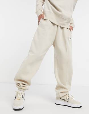 Nike mini swoosh oversized joggers in cream - CREAM - ASOS Price Checker