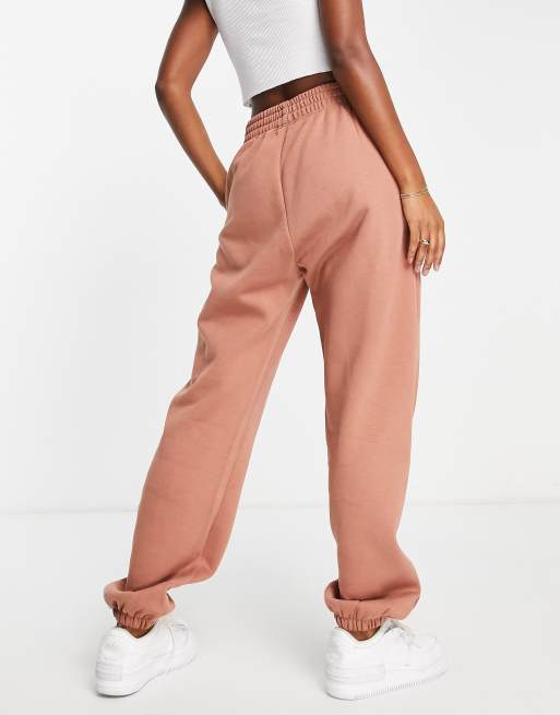 Nike mini swoosh oversized joggers in desert sand, ASOS