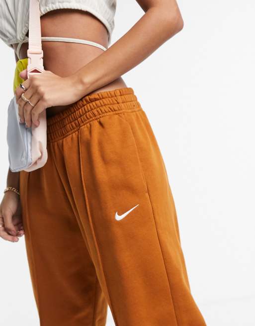 Nike Mini Swoosh Oversized Joggers In Tawny Brown from ASOS